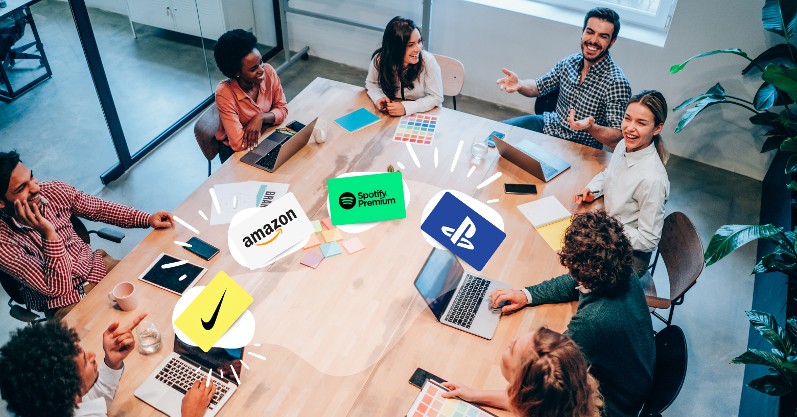 Multiple employees meeting at table enjoying egifts as employee reward